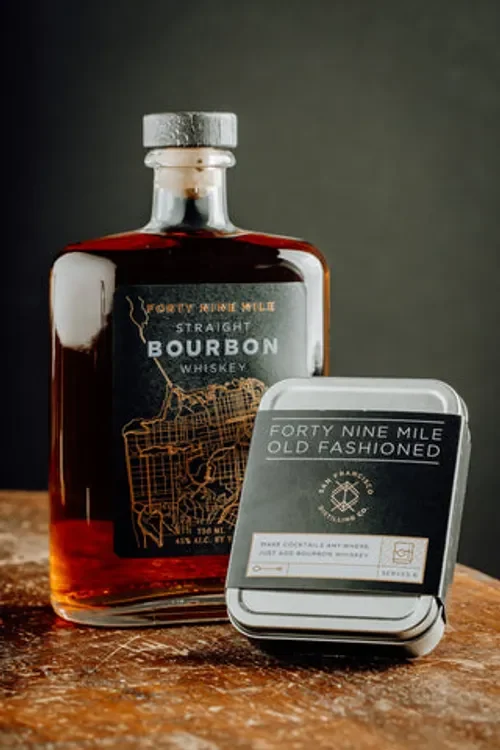 Forty Nine Mile Bourbon bottle with polished bronze tones on display